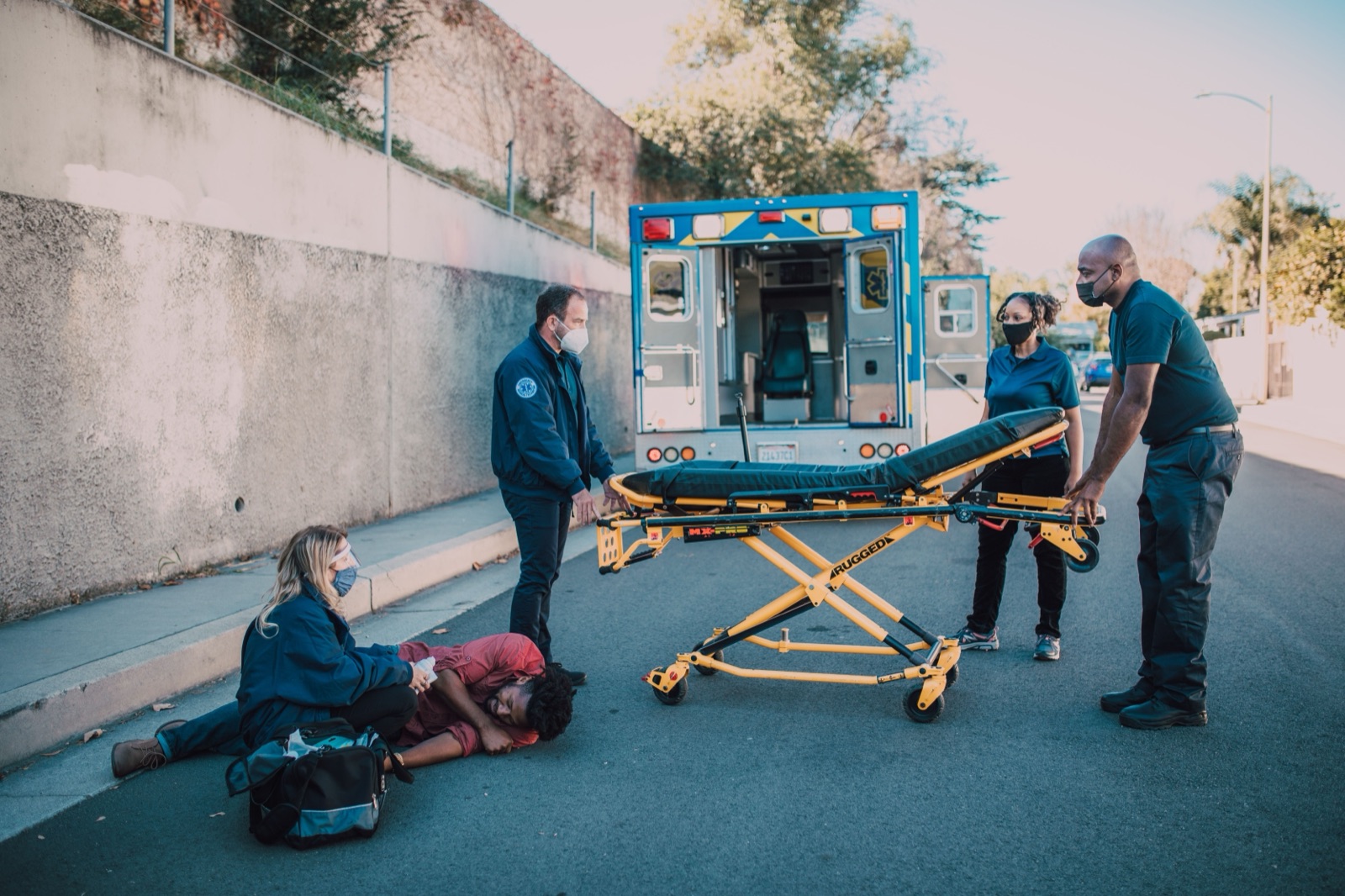 EMTs assessing a patient in the field